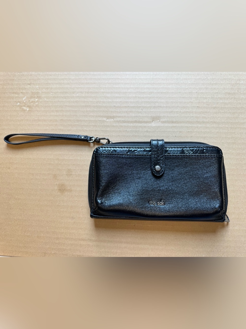 The Sak Black Leather Wristlet Clutch with Snap Strap